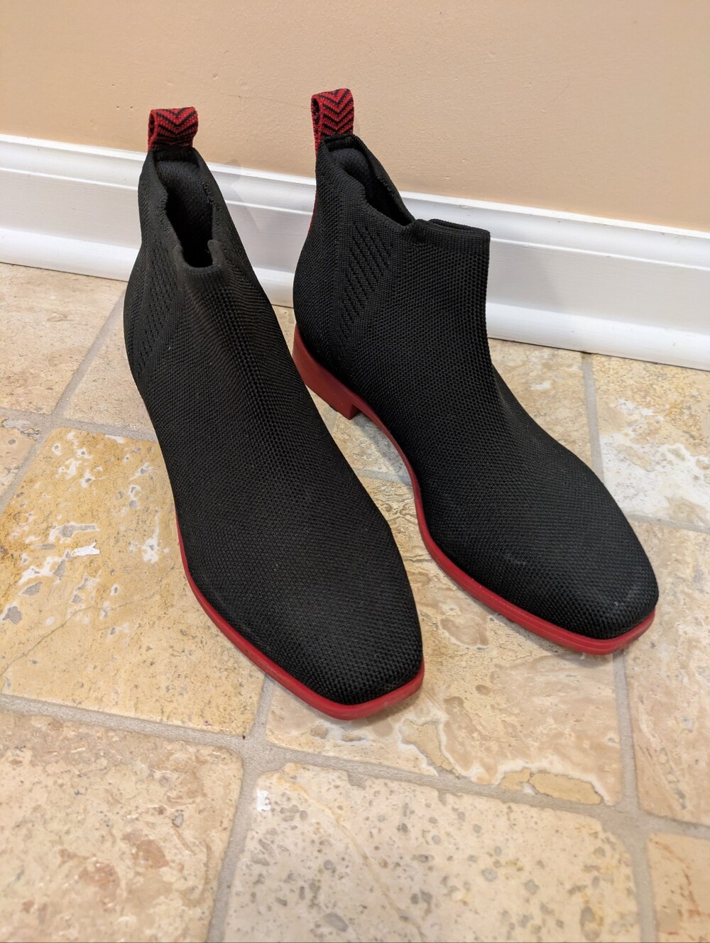 Women’s Black Knit Chelsea Boots with Red Trim.